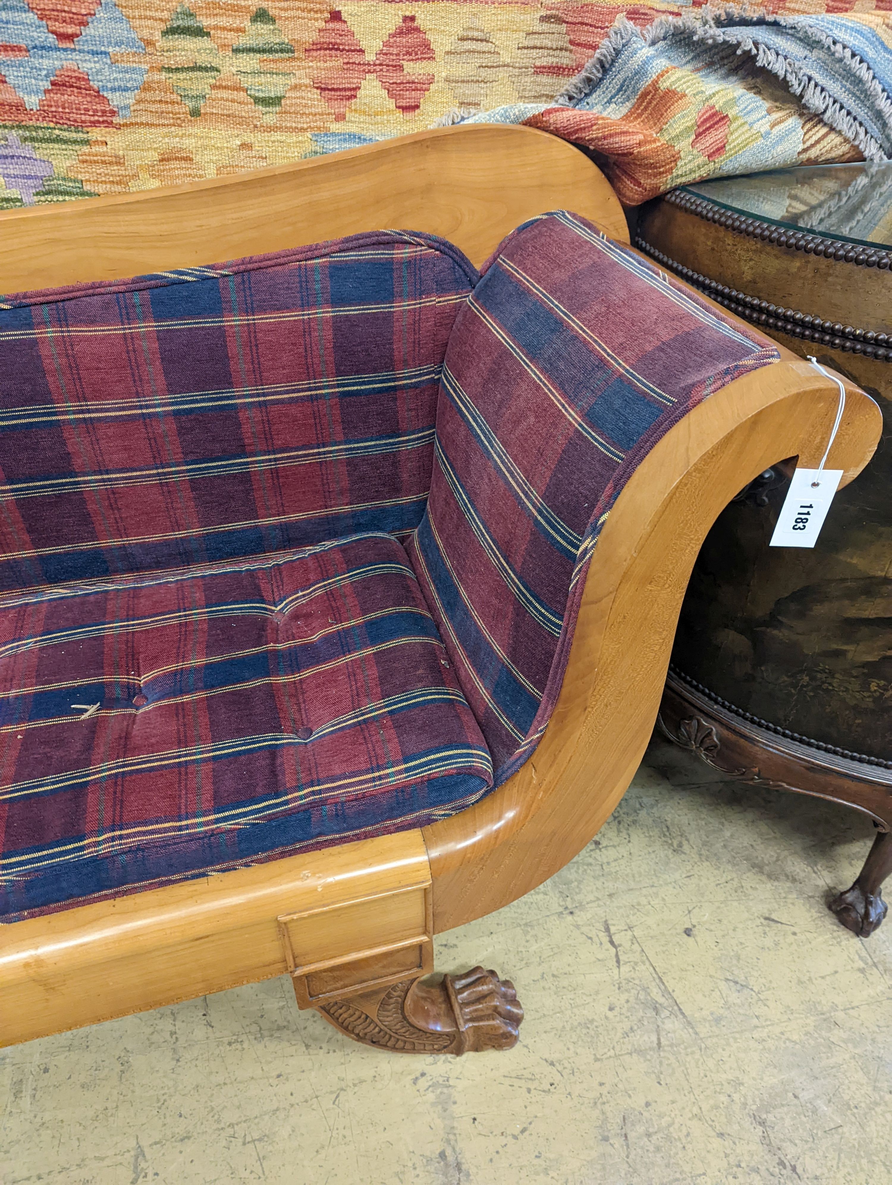 A Biedermier style cherry scroll arm settee with buttoned squab cushion on carved claw feet, length 200cm, depth 51cm, height 97cm